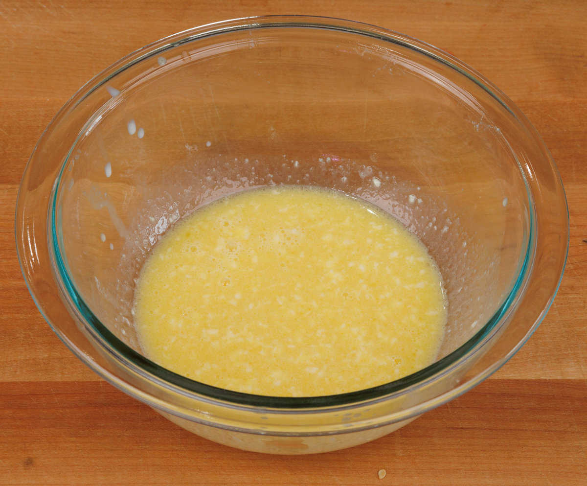 egg, milk, and butter in a mixing bowl