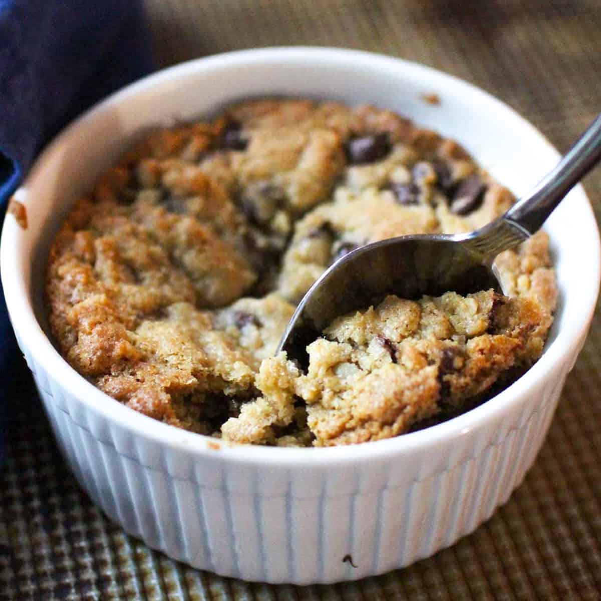 a single serve chocolate chip cookie in a deep dish.