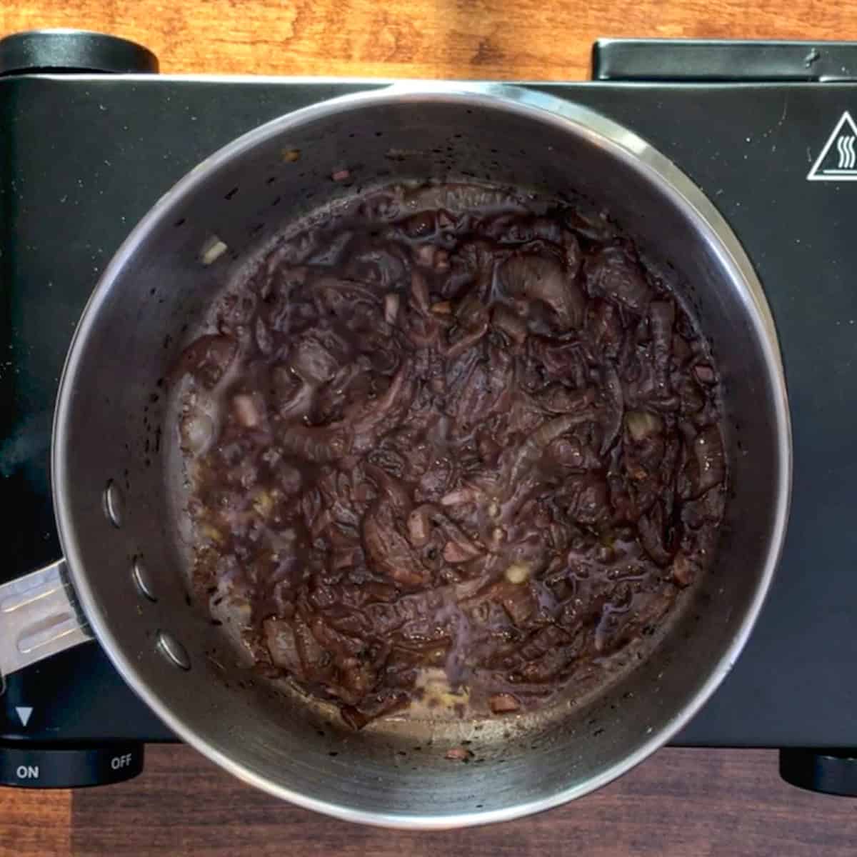 red wine deglazing a pan.