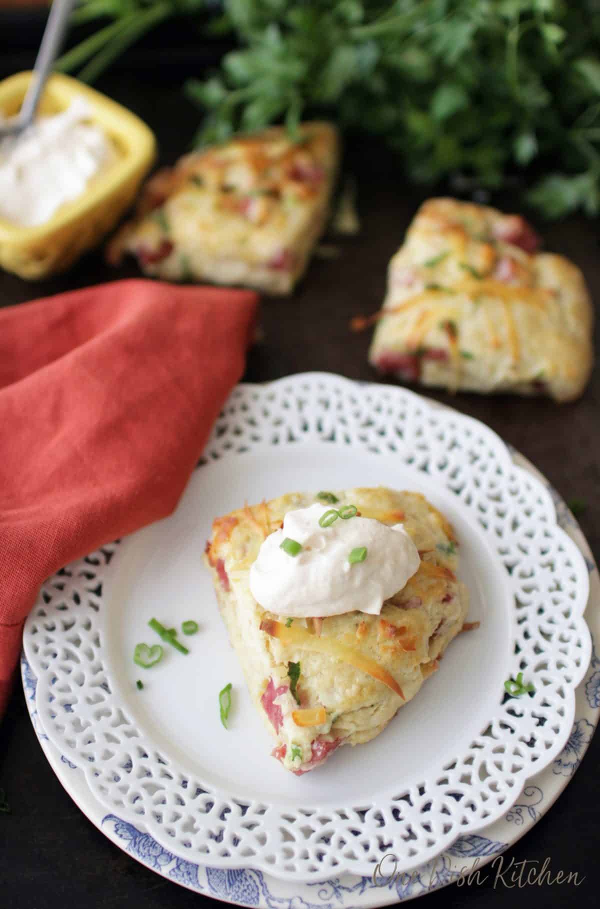 an overhead picture of a ham and cheese scone with horseradish cream spread over the top.
