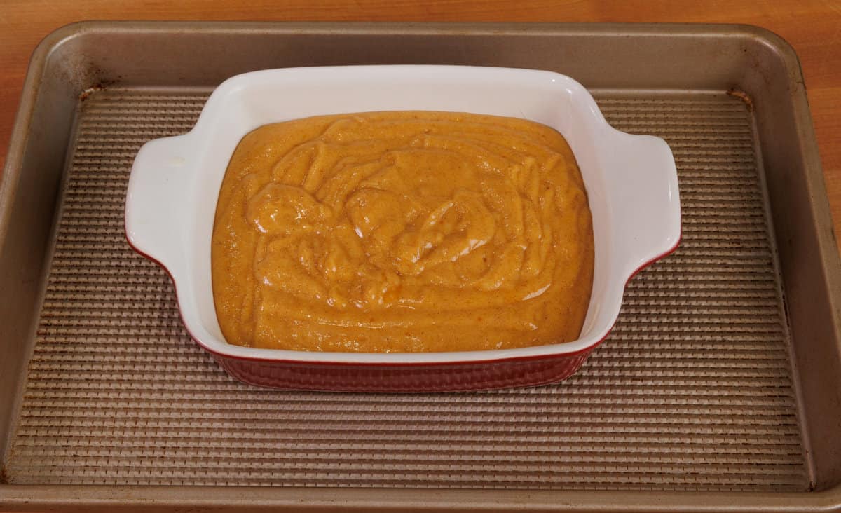 unbaked pumpkin bars in a small baking dish