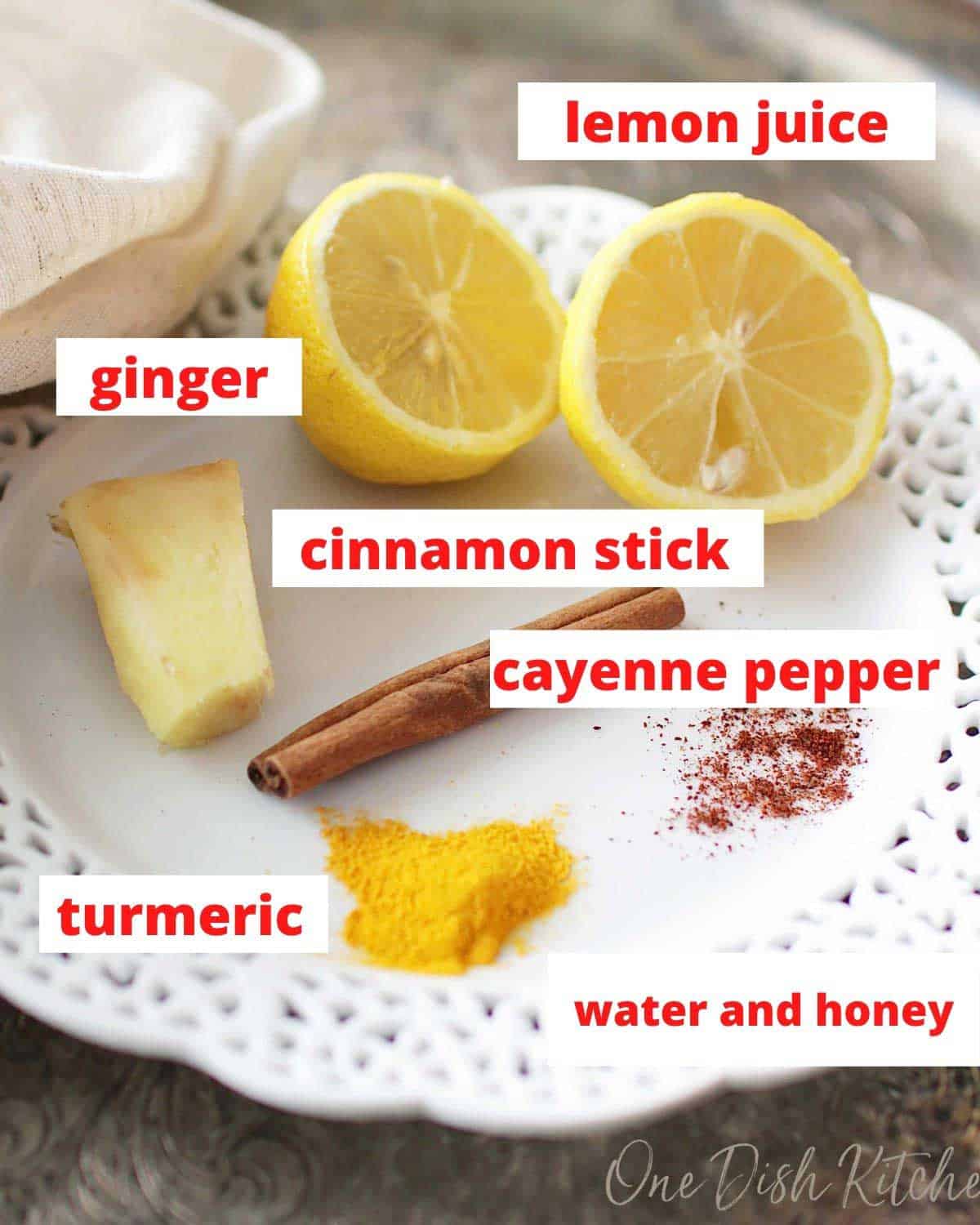 ginger, lemon juice, cinnamon and spices on a plate.
