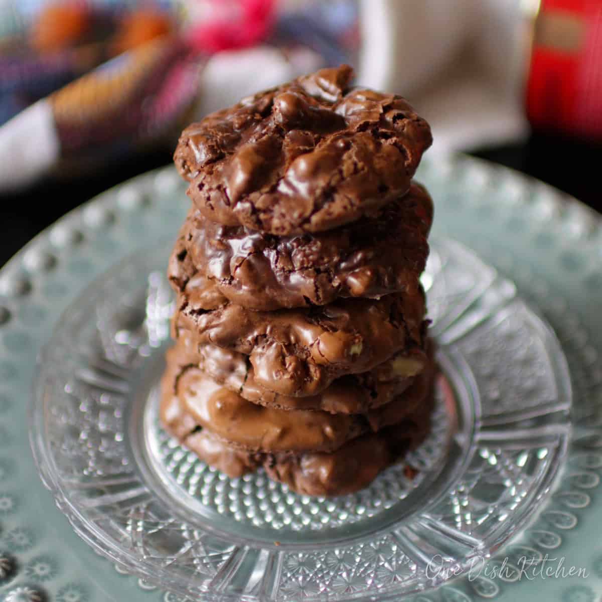 a small batch of flourless chocolate cookies on a plate.