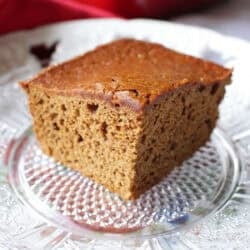 a slice of gingerbread cake on a plate.