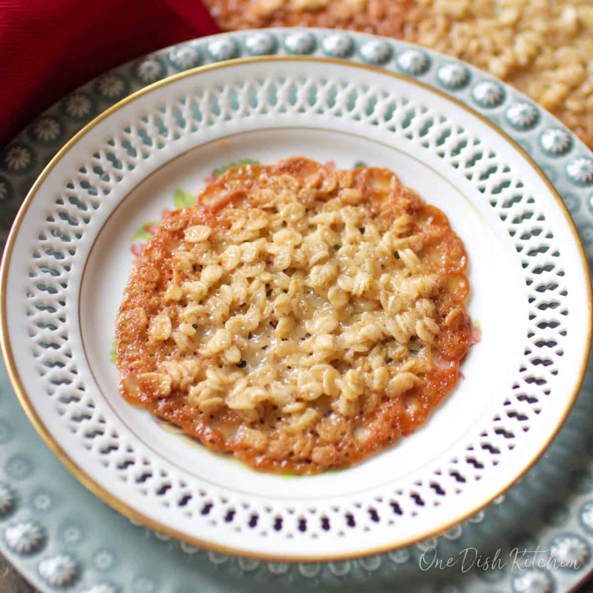 one florentine lace cookie on a white plate.