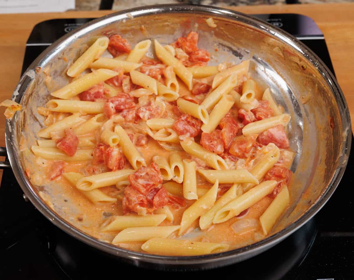 cooked penne in vodka sauce in a small skillet