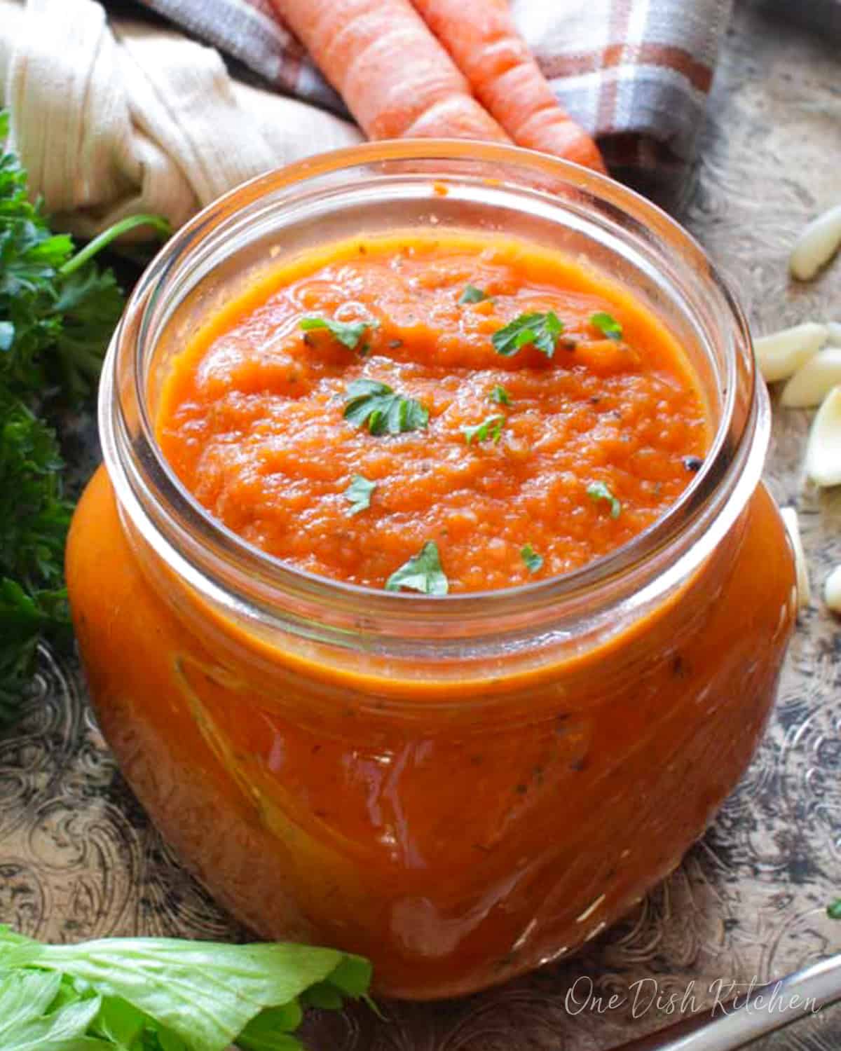 a small batch of homemade tomato sauce in a jar.