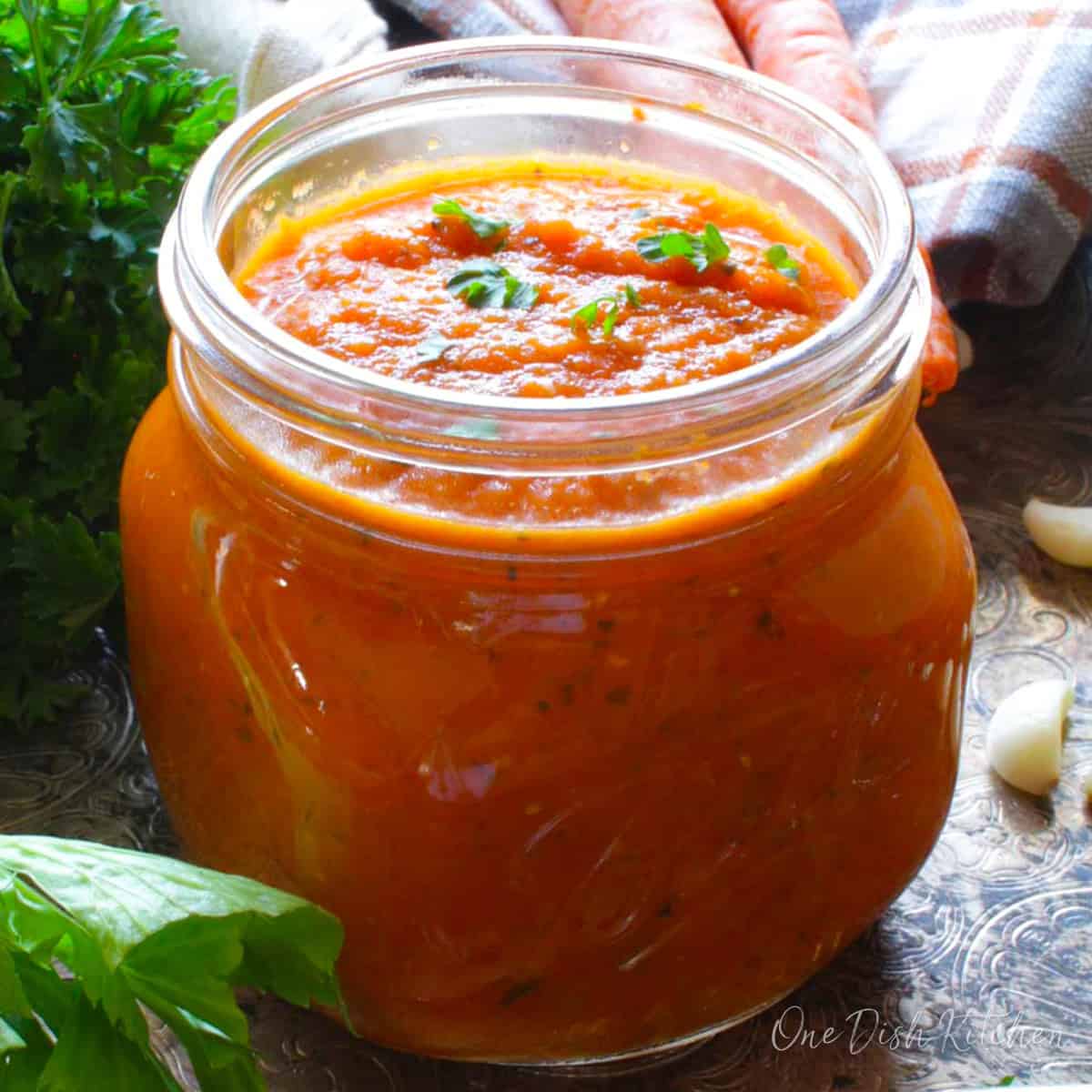 a single serving of tomato sauce in a small jar.