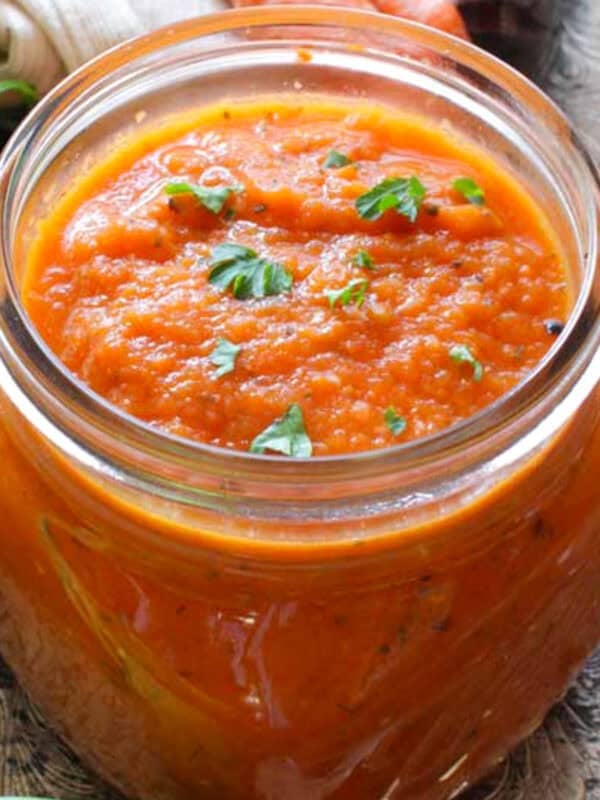 a small batch of homemade tomato sauce in a jar.