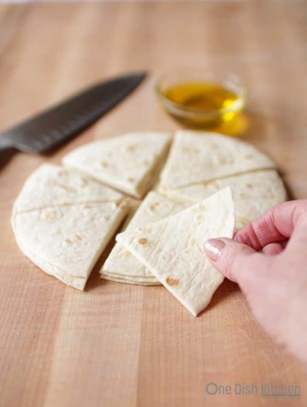 stack of fresh tortilla cut into eight slices like a pizza