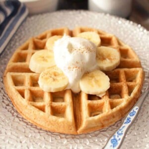 waffle with bananas and cream on top