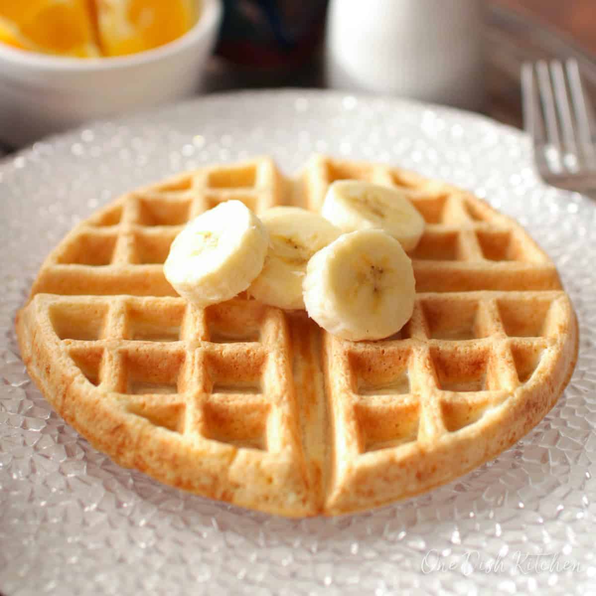 one waffle topped with slices of bananas.