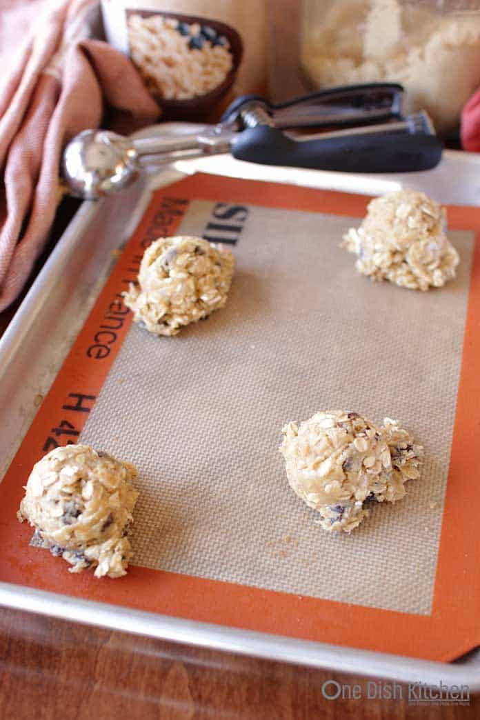Oatmeal cookie dough on a baking sheet.