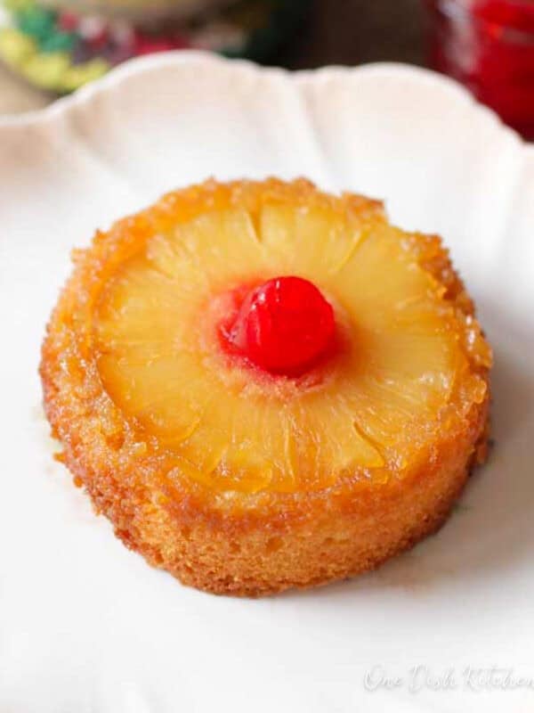 a mini pineapple upside down cake on a white plate.