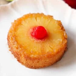 a mini pineapple upside down cake on a white plate.