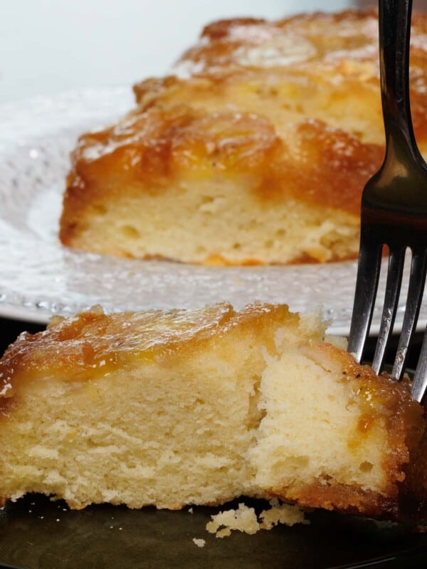 a fork in a caramelized banana upside down cake