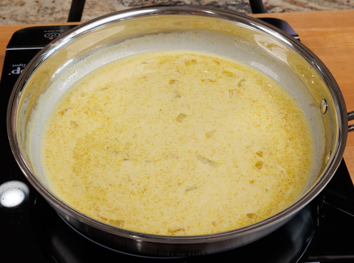 a curry simmering in a skillet