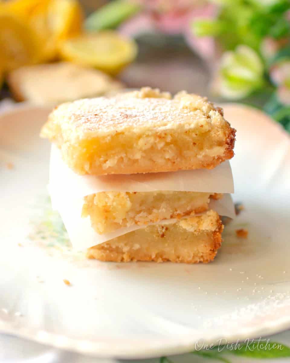 three lemon bars stacked on top of each other.