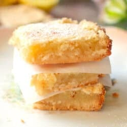 three lemon bars stacked on top of each other.