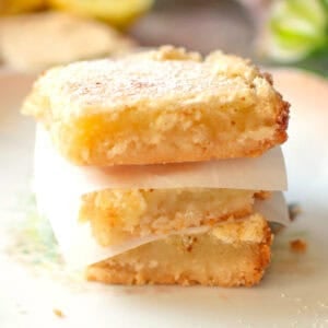 three lemon bars stacked on top of each other.