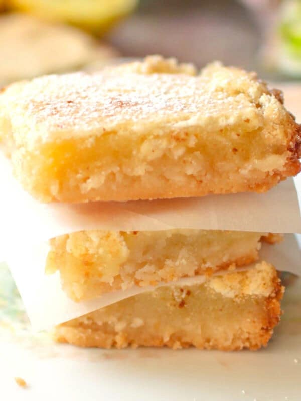 three lemon bars stacked on top of each other.