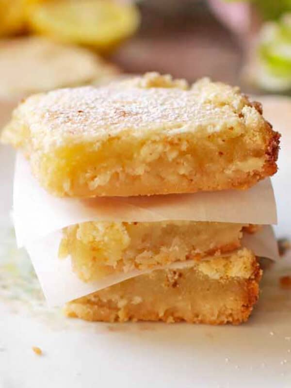 three lemon bars stacked on top of each other.