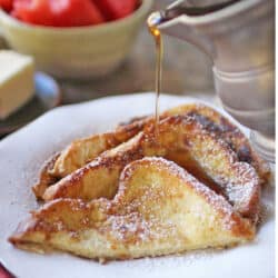french toast slices with syrup poured on top.