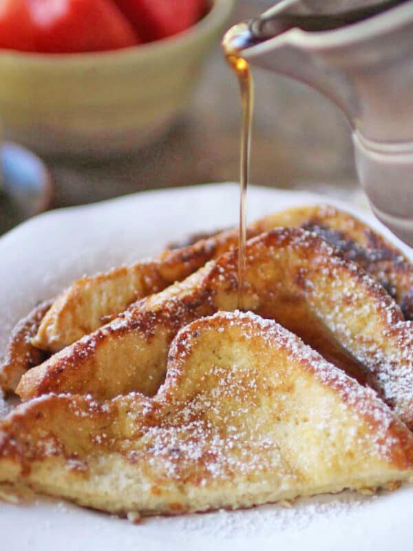 french toast slices with syrup poured on top.