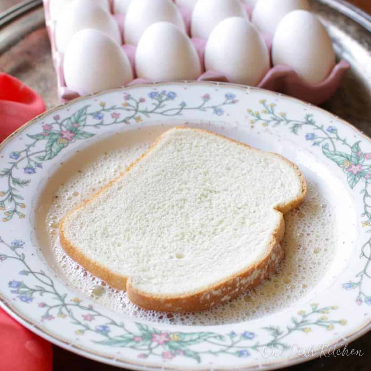 a slice of bread soaking in a bowl of milk.