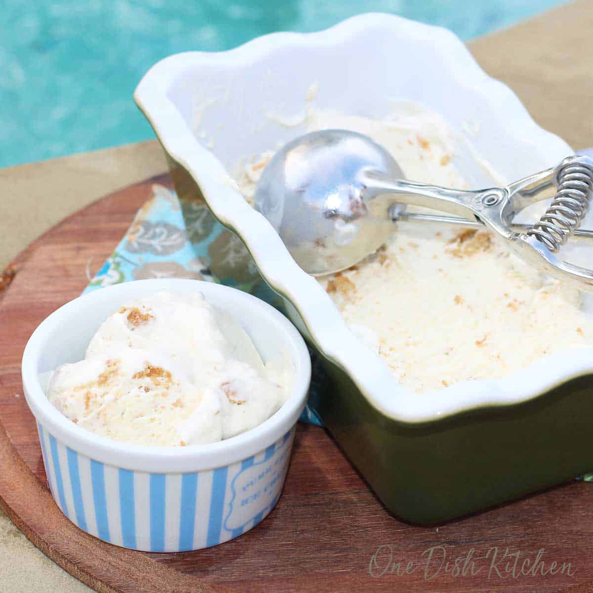 a bowl of key lime pie ice cream next to a container of the ice cream.