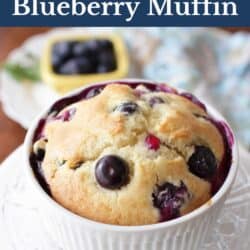 one mini blueberry muffin in a white ramekin.