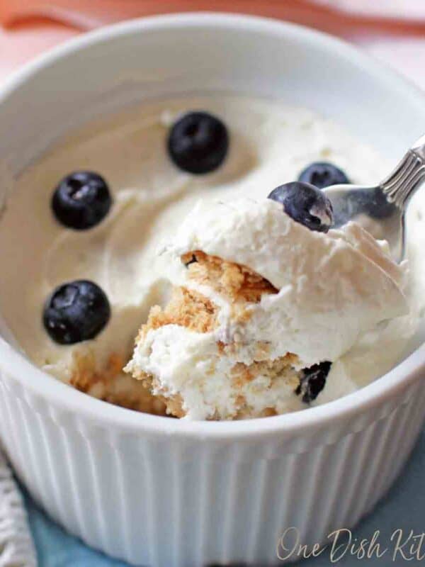a ramekin filled with a small icebox cake topped with blueberries.