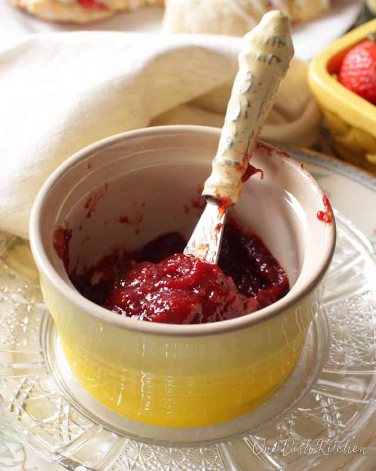 a small jar of strawberry jam.