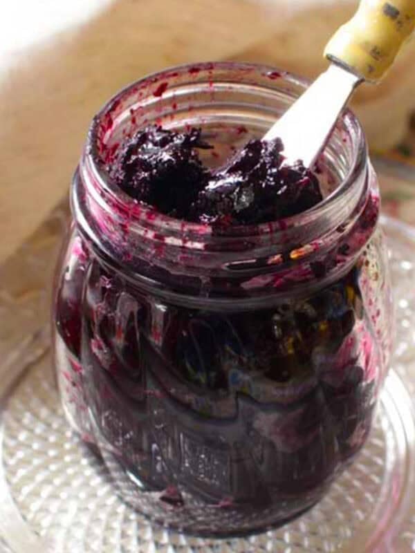 a jar of jam on a kitchen table.