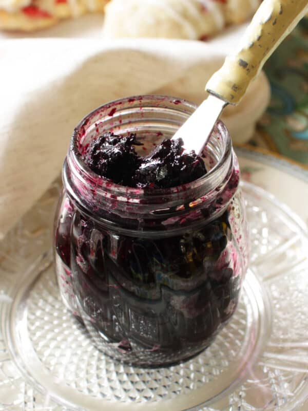 a jar of jam on a kitchen table.