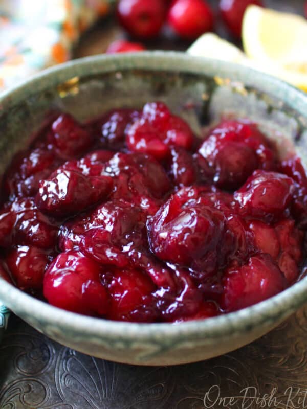 a small bowl of cherry pie filling on a tray.