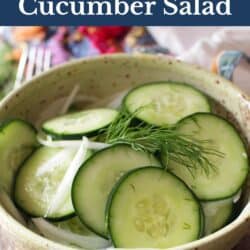 cucumber salad with onions in a yellow bowl.