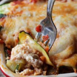 a close up of a dish of lasagna with zucchini.