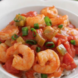 a white bowl filled with shrimp creole