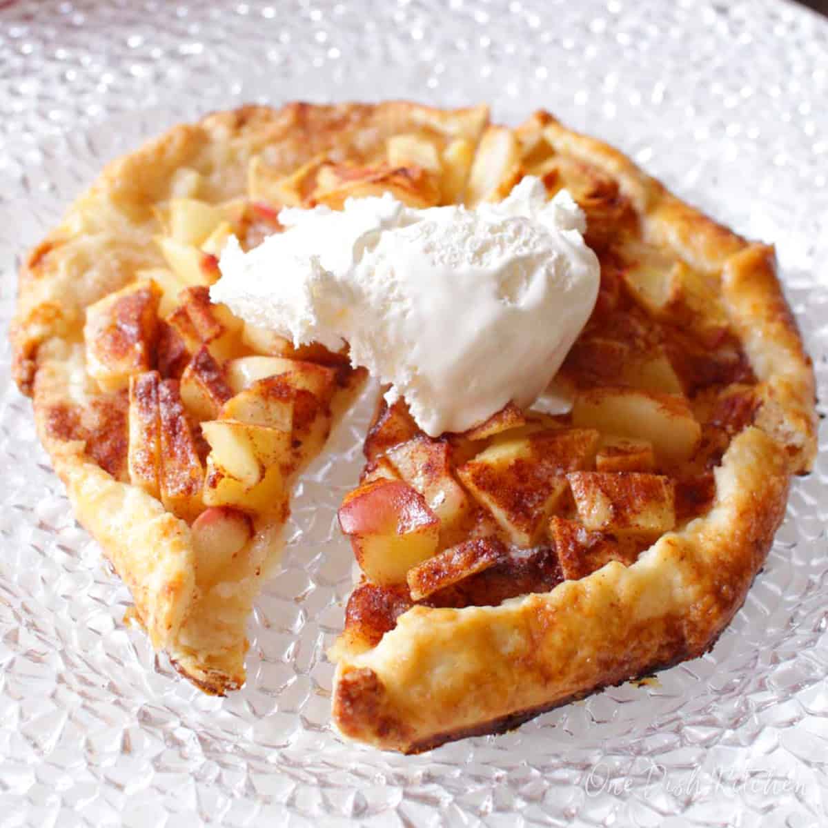 a small apple galette topped with vanilla ice cream.