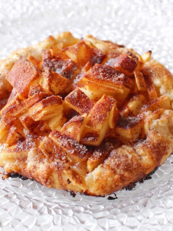 a small apple galette on a white plate.