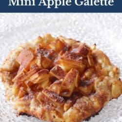 a small apple galette on a white plate.