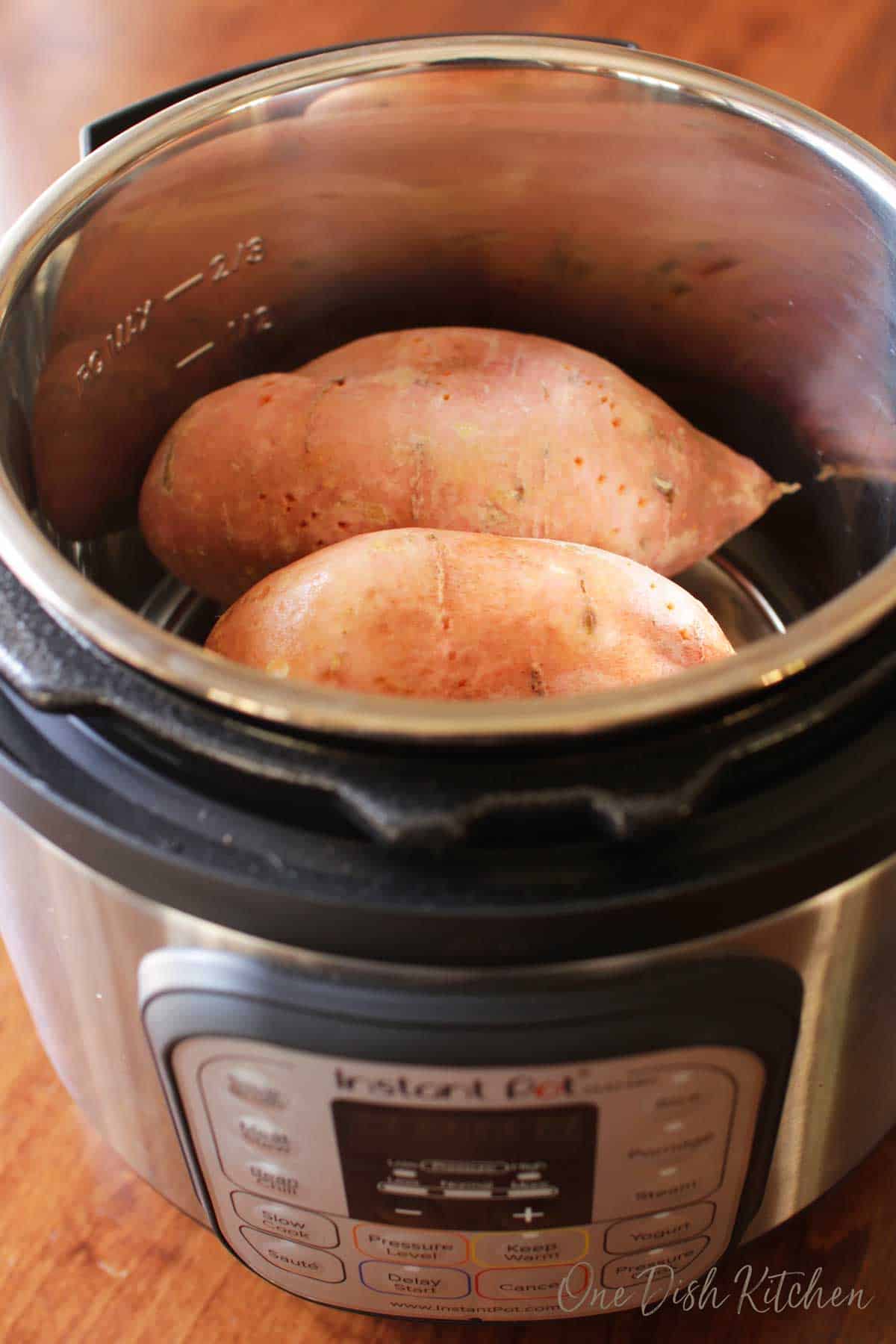 Two sweet potatoes in an instant pot.