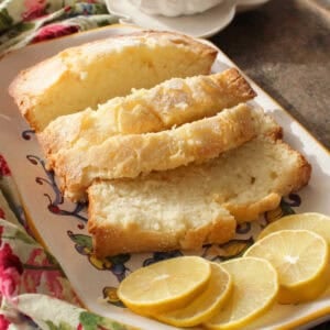 slices of a small pound cake on a white plate.
