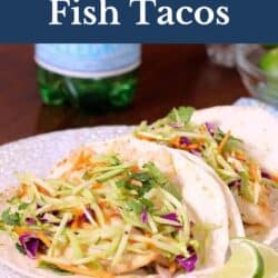 two fish tacos on a plate.