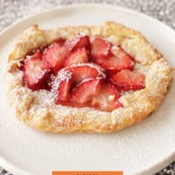 a small pie crust filled with strawberries.