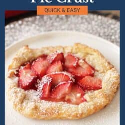 a small pie crust filled with strawberries.