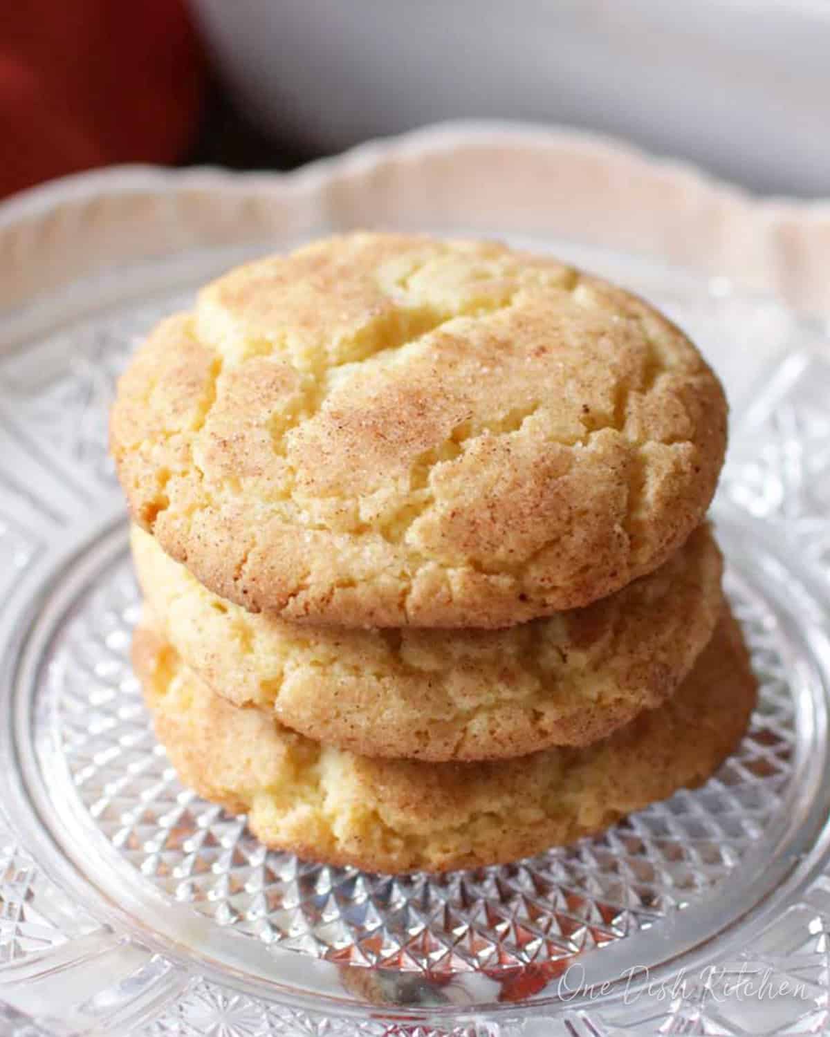 three snickerdoodles on a plate.