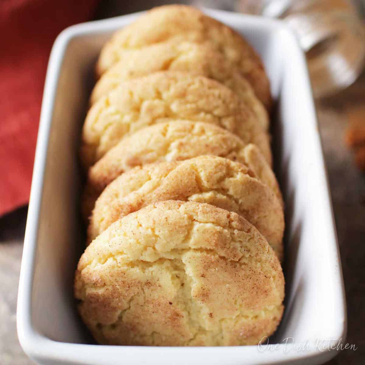 Six snickerdoodle cookies placed in a loaf pan.