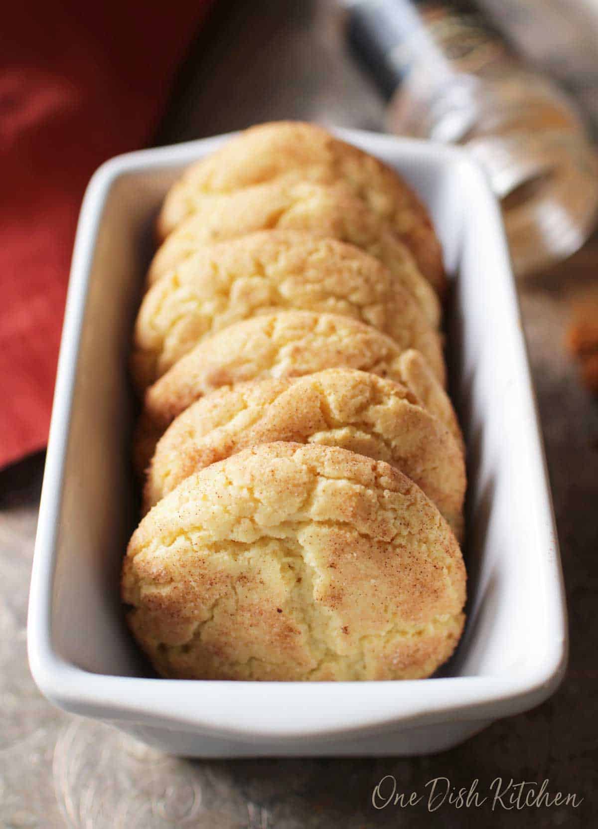 Six snickerdoodle cookies placed in a loaf pan.